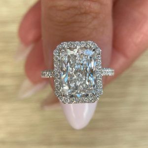 Radiant cut diamond engagement ring with halo and pavé-set thin band