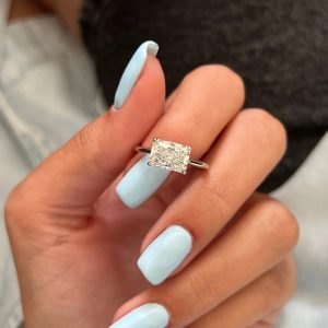 Rectangular cushion solitaire engagement ring with narrow polished band