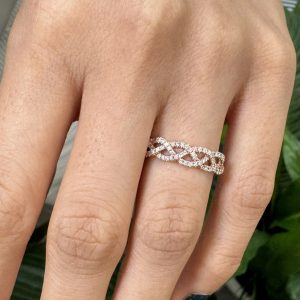 Criss-cross pavé diamond band with intertwined rows and round stones