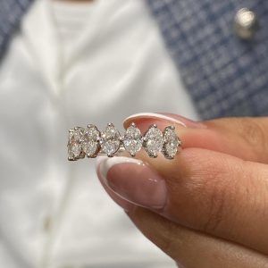 Marquise diamond band with shared prong setting displayed at an angle