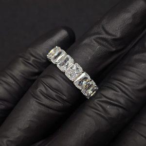 Cushion cut diamond eternity band with shared prong setting, full circle view