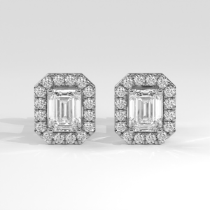 Pair of emerald cut diamond stud earrings with round halo on stud backings